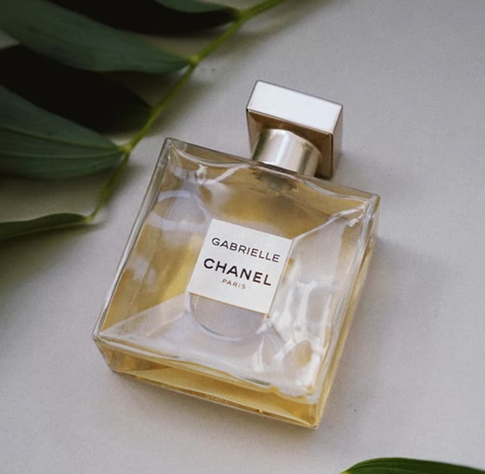 Gabrielle Essence Eau De Parfum bottle on a table